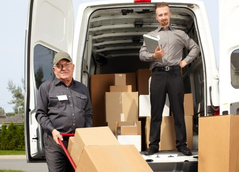 Supervisor checking health and safety compliance in a storage unit