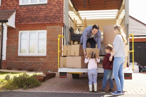 Packed boxes and furniture prepared for temporary storage in Brentcross