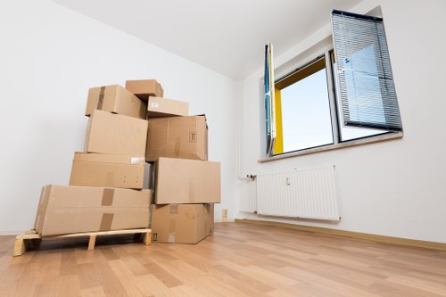 Removal team handling furniture for a Brentcross relocation