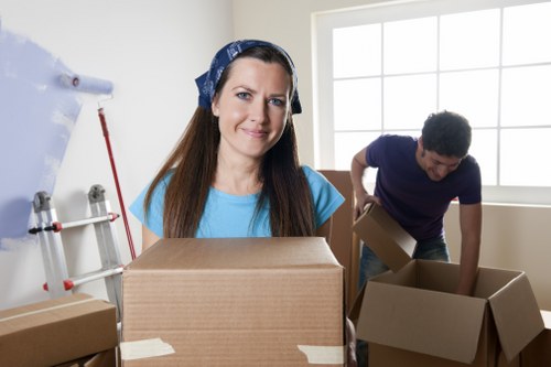 Packed office furniture and equipment ready for relocation in Brentcross
