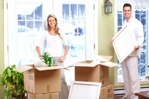 Packed moving boxes ready for transport in Brentcross